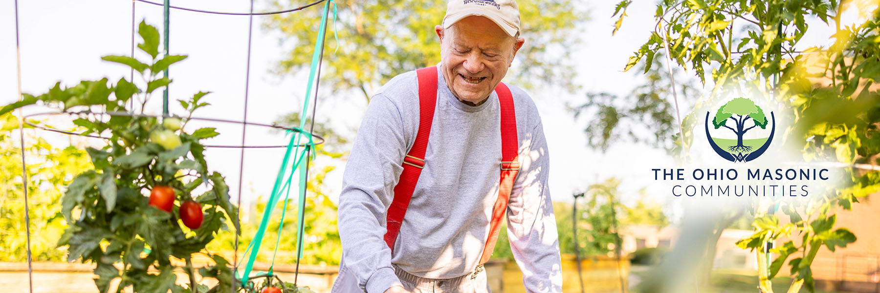 Older senior man enjoys gardening in the summertime as an activity to stay active
