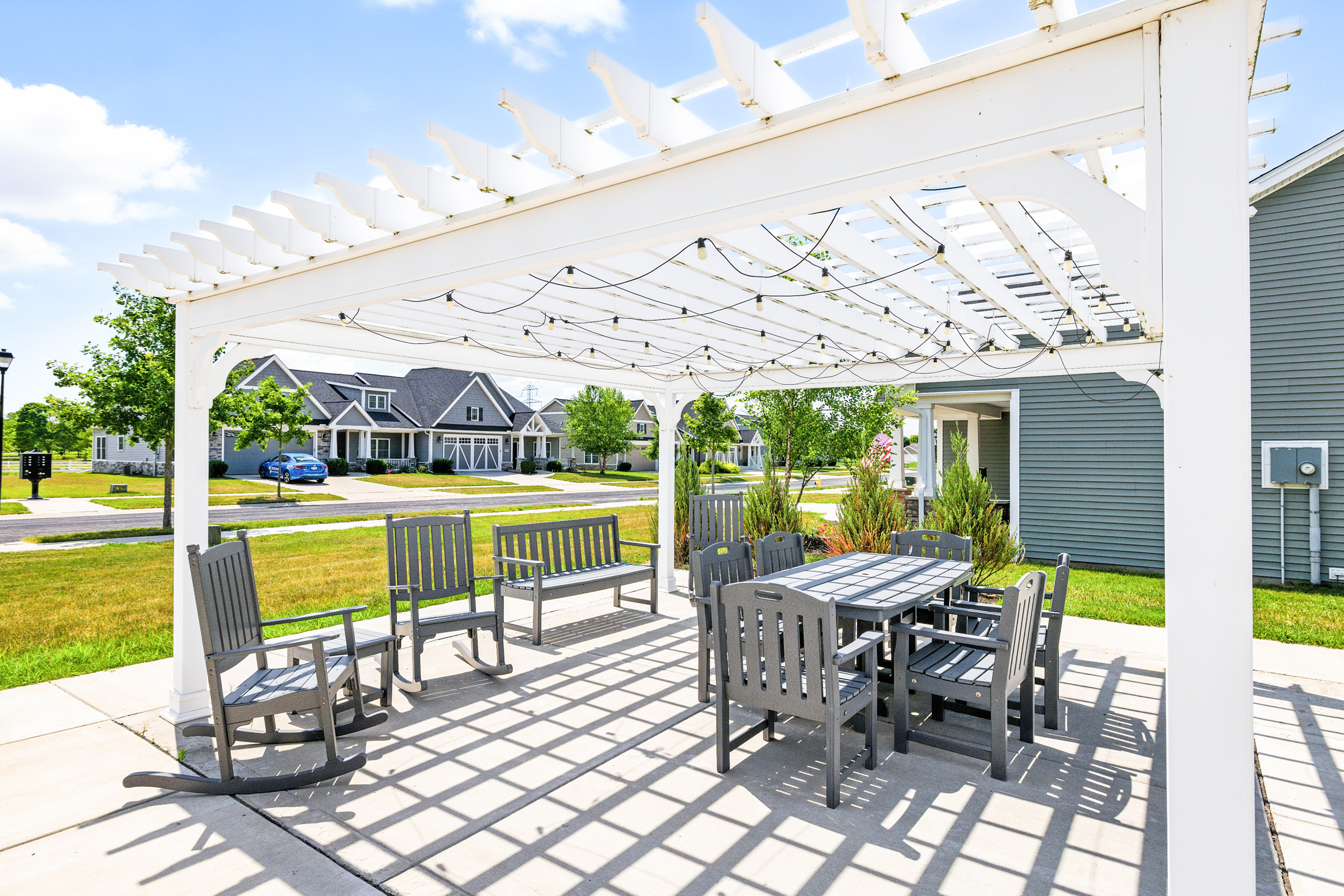 Outdoor patio with tables and chairs near villas