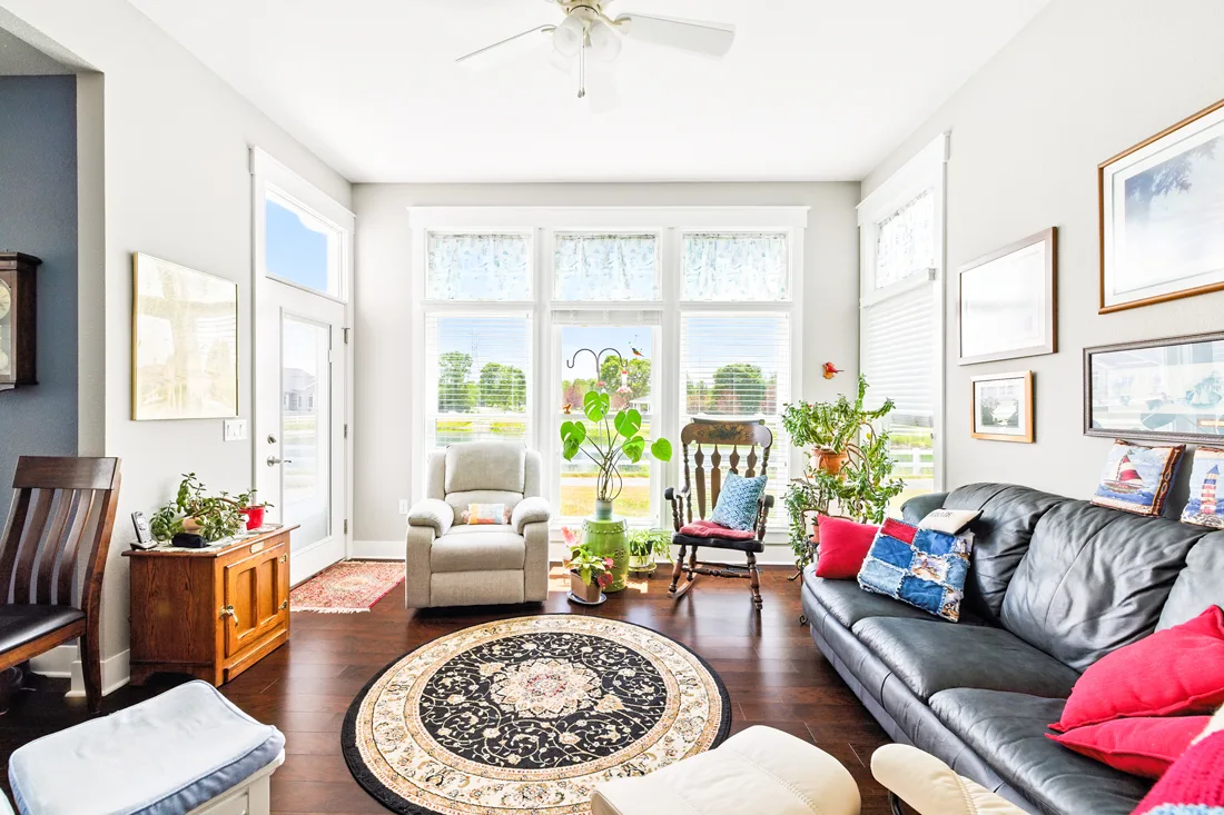 Large independent living room with couch and chairs