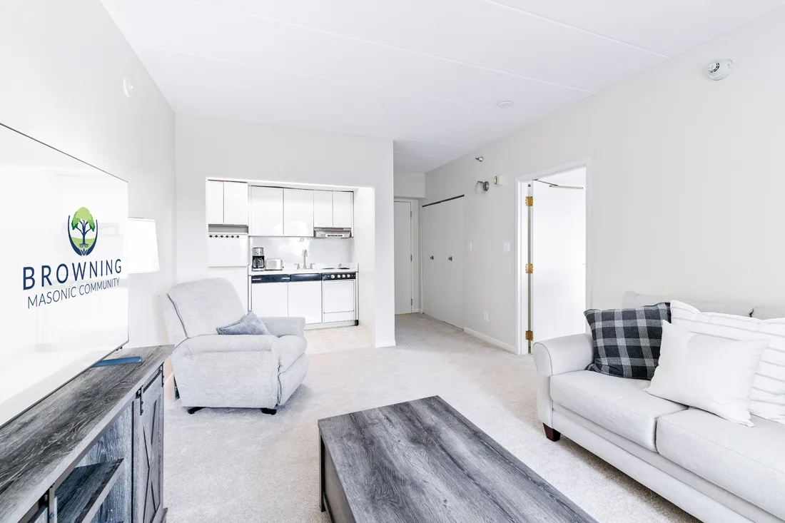 Apartment living area with small kitchen