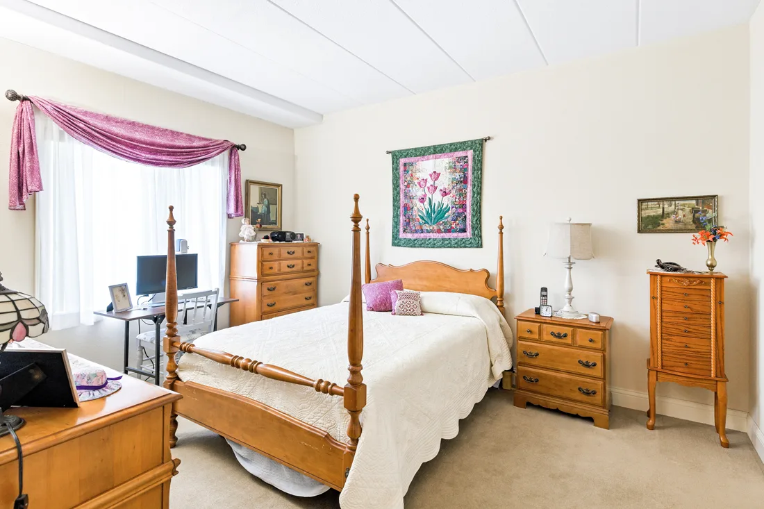 Bedroom with bedroom furniture and a desk and chair