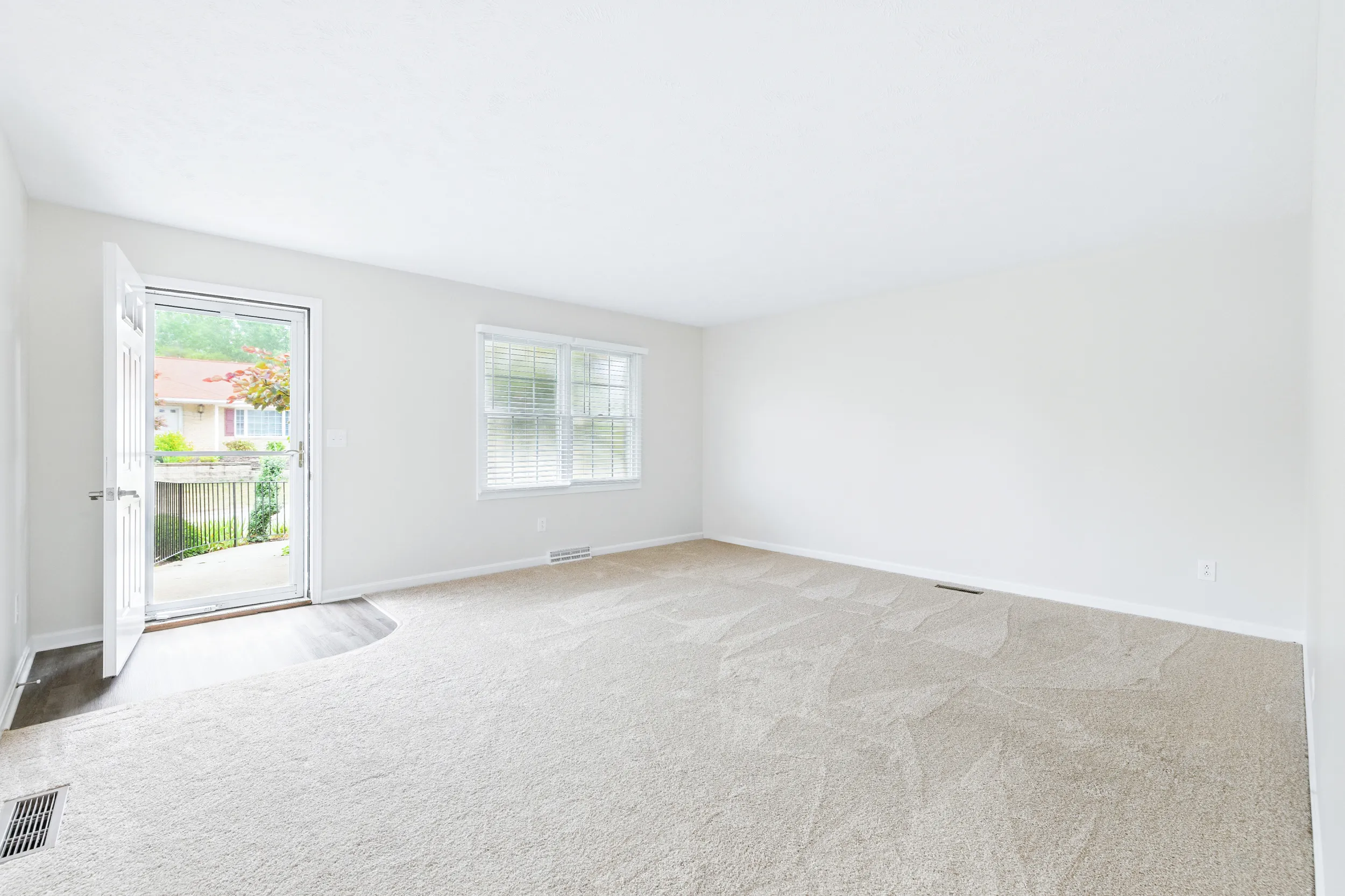 Front door leading into a living room