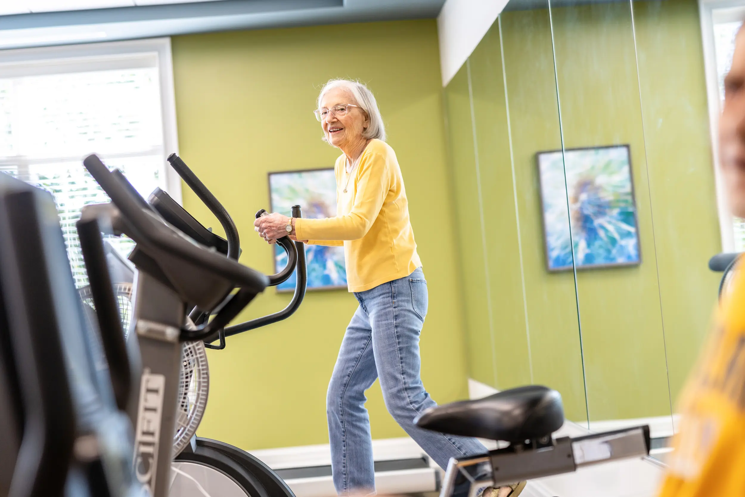 Older adults exercising in a fitness center