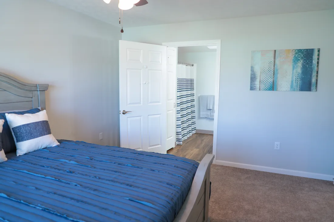 Bedroom with an attached bathroom