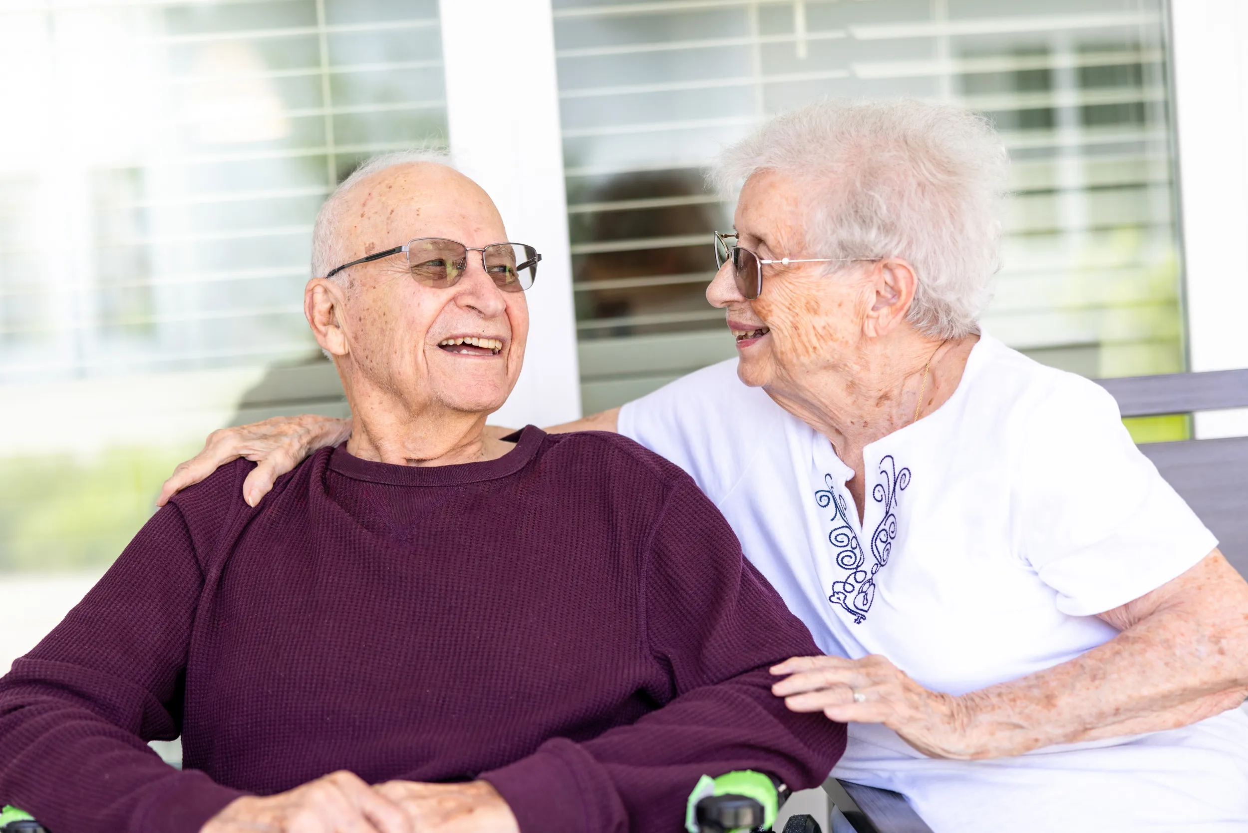 Residents sitting outdoors together on a patio