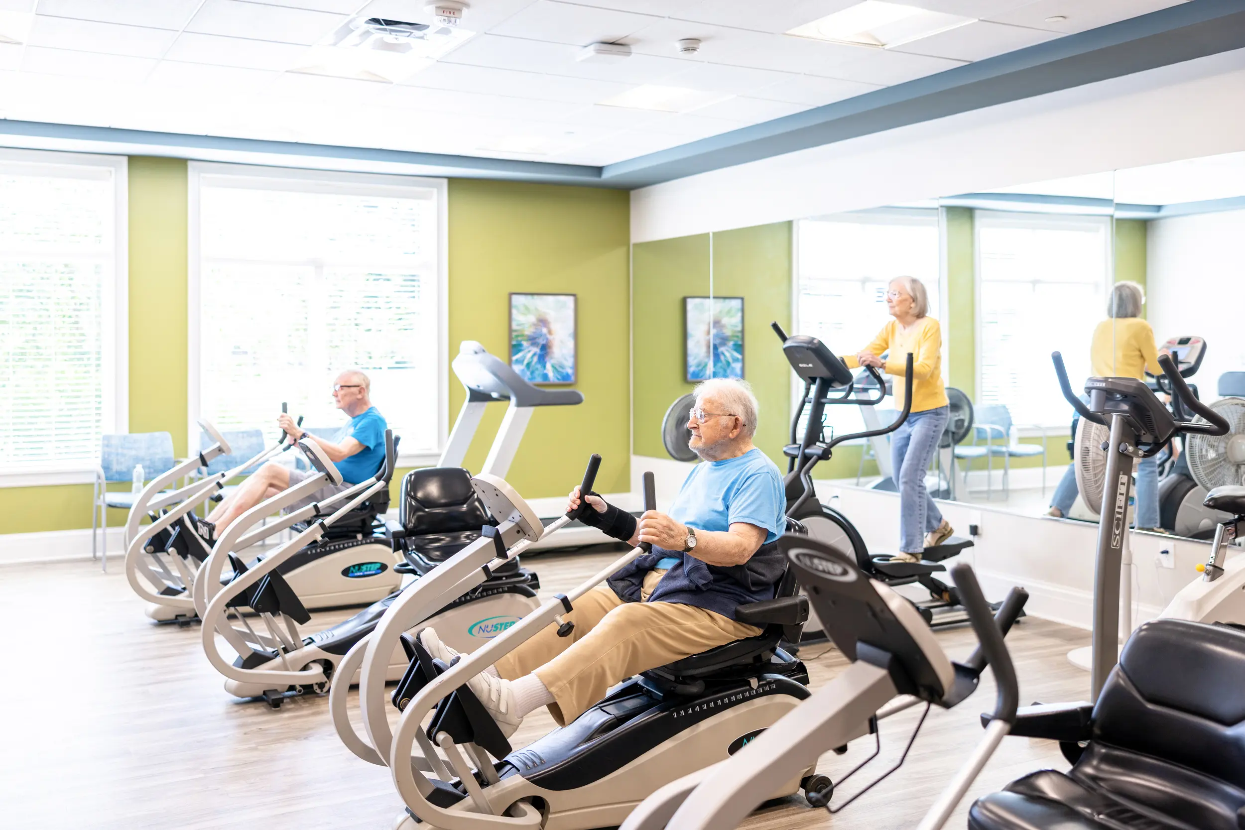 Older adults exercising in a fitness center
