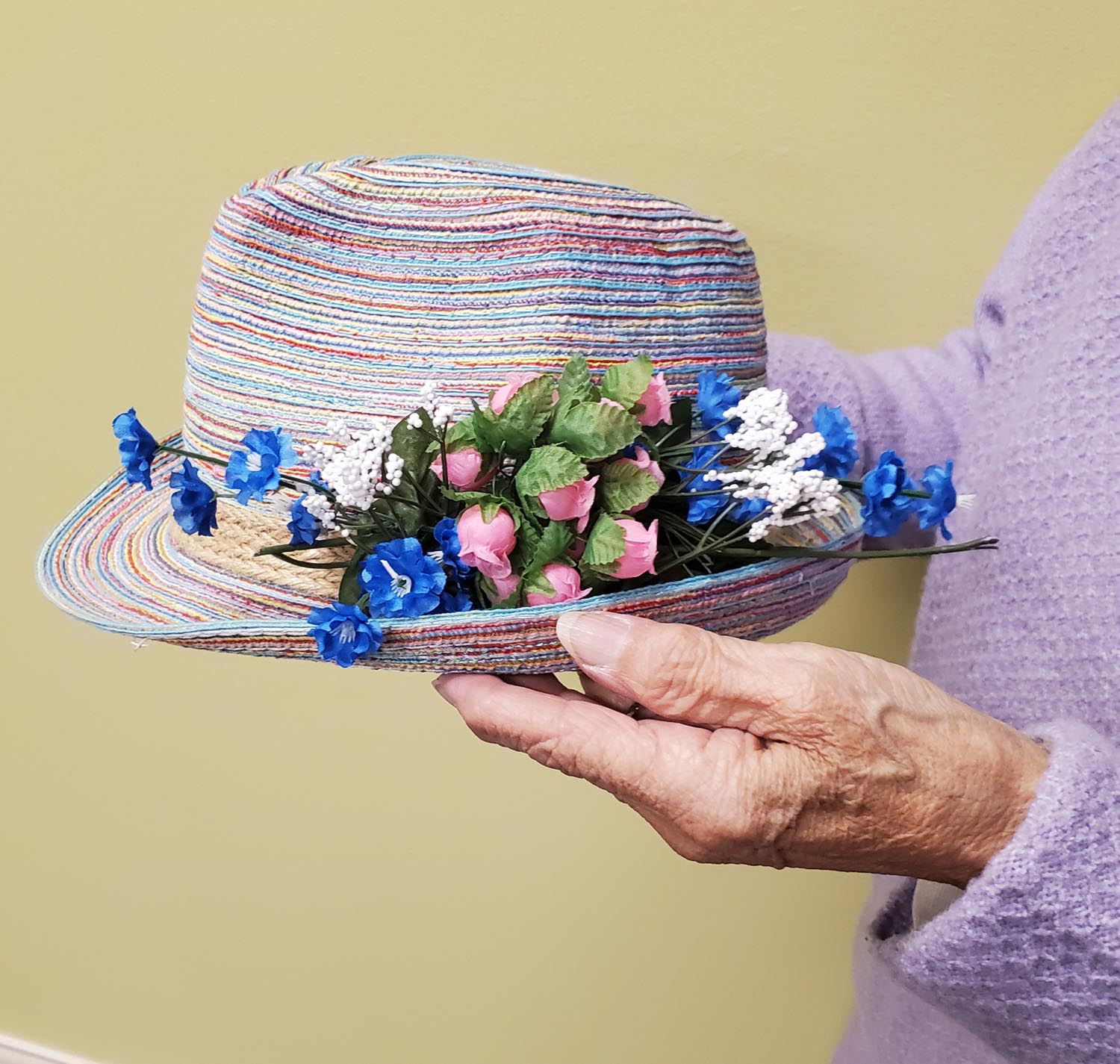 Close up view of hat decorated with flowers