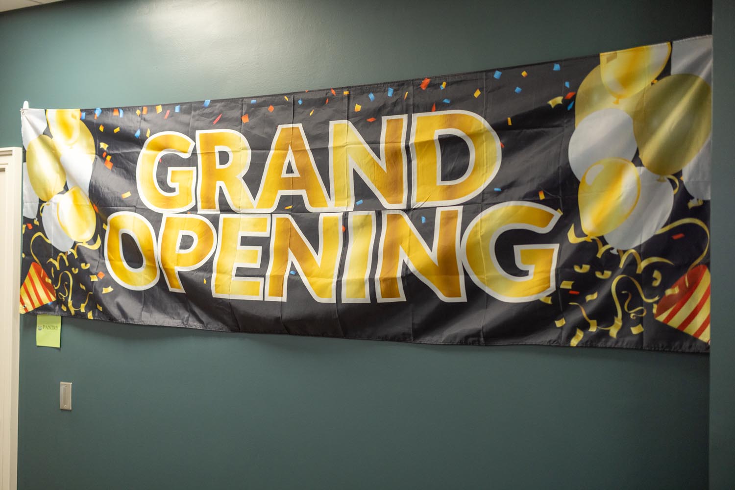 Grand Opening banner on the wall