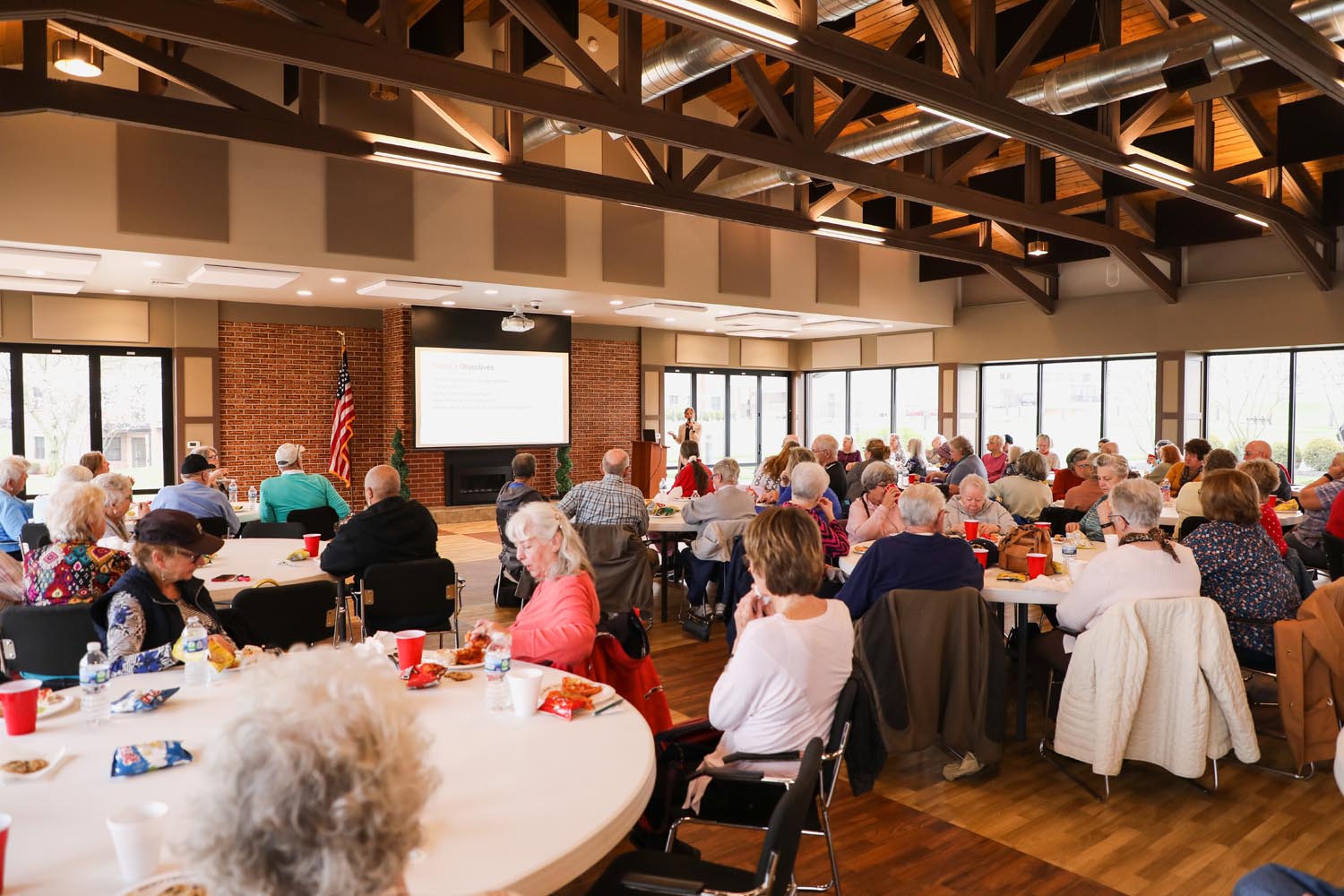 Residents and guests dine together at a program