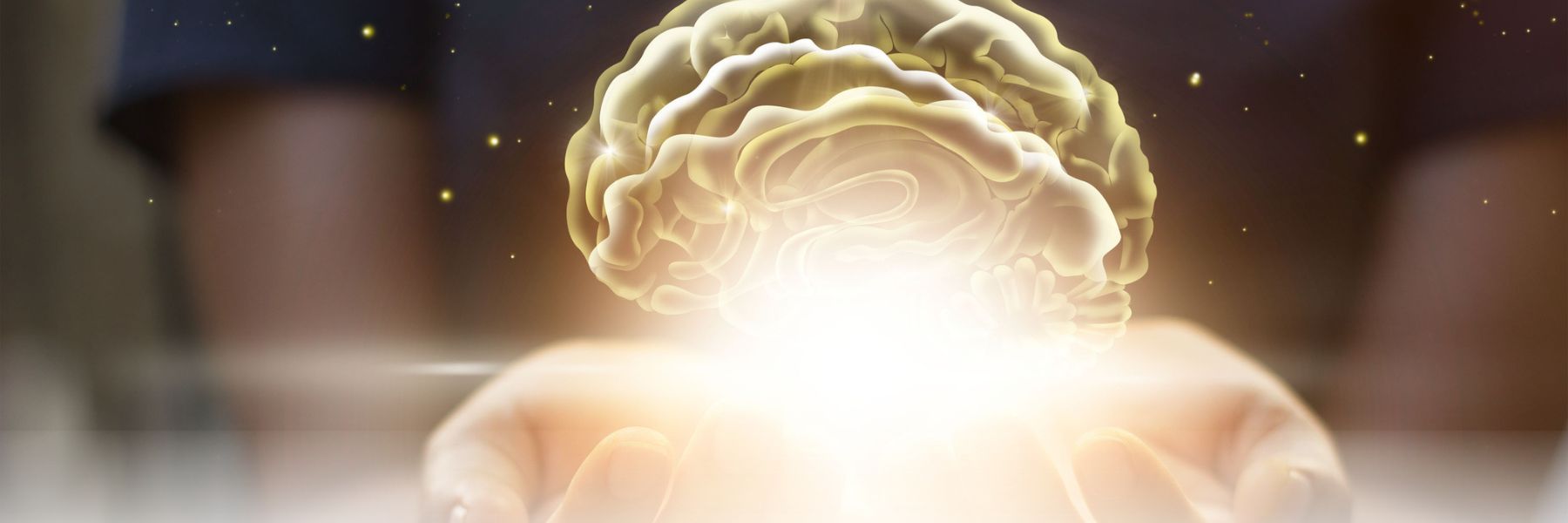 Hands holding a brain graphic