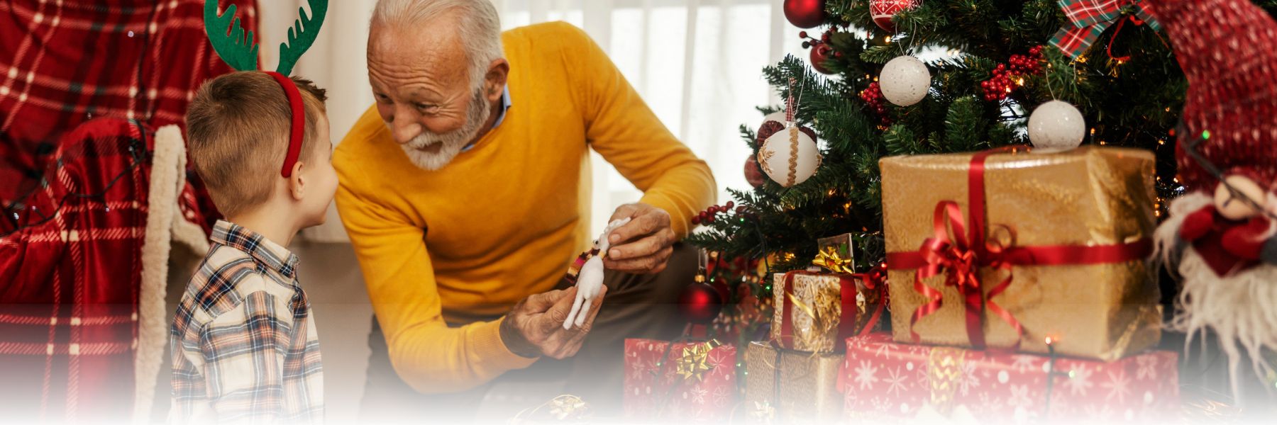 Holiday Activities for the Whole Family with older adult man and child looking at gifts