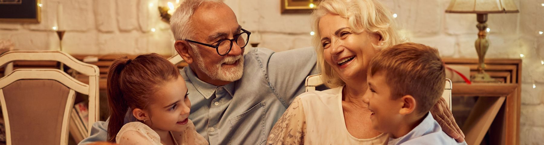 Grandparents embracing grandchildren