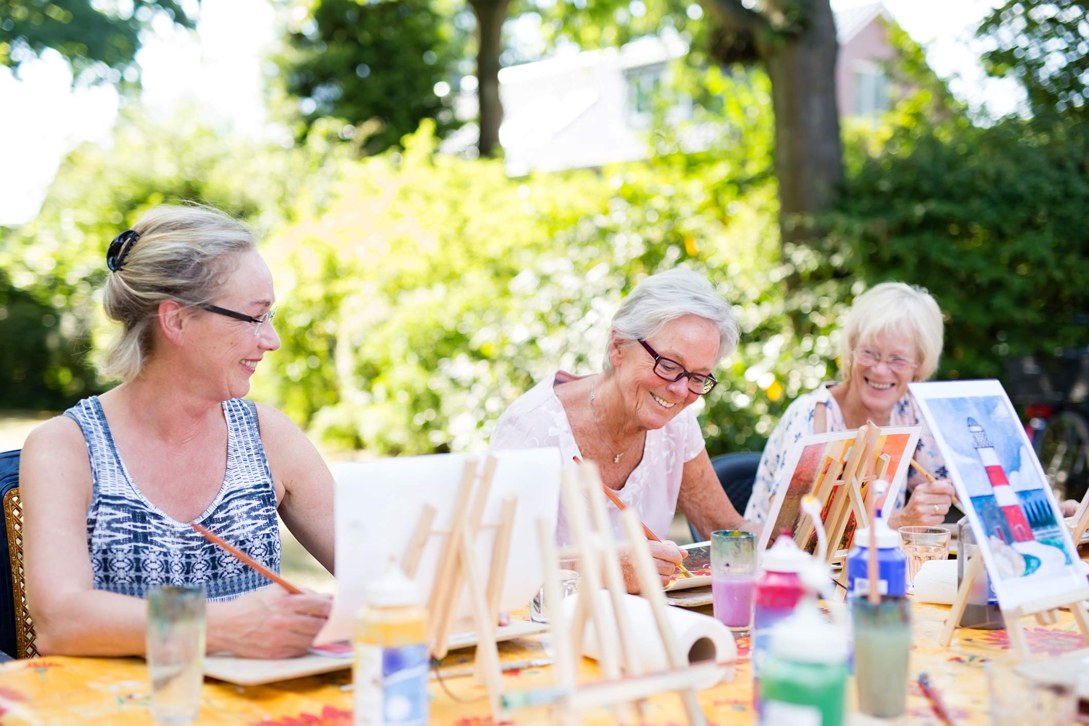 Females painting outdoors together
