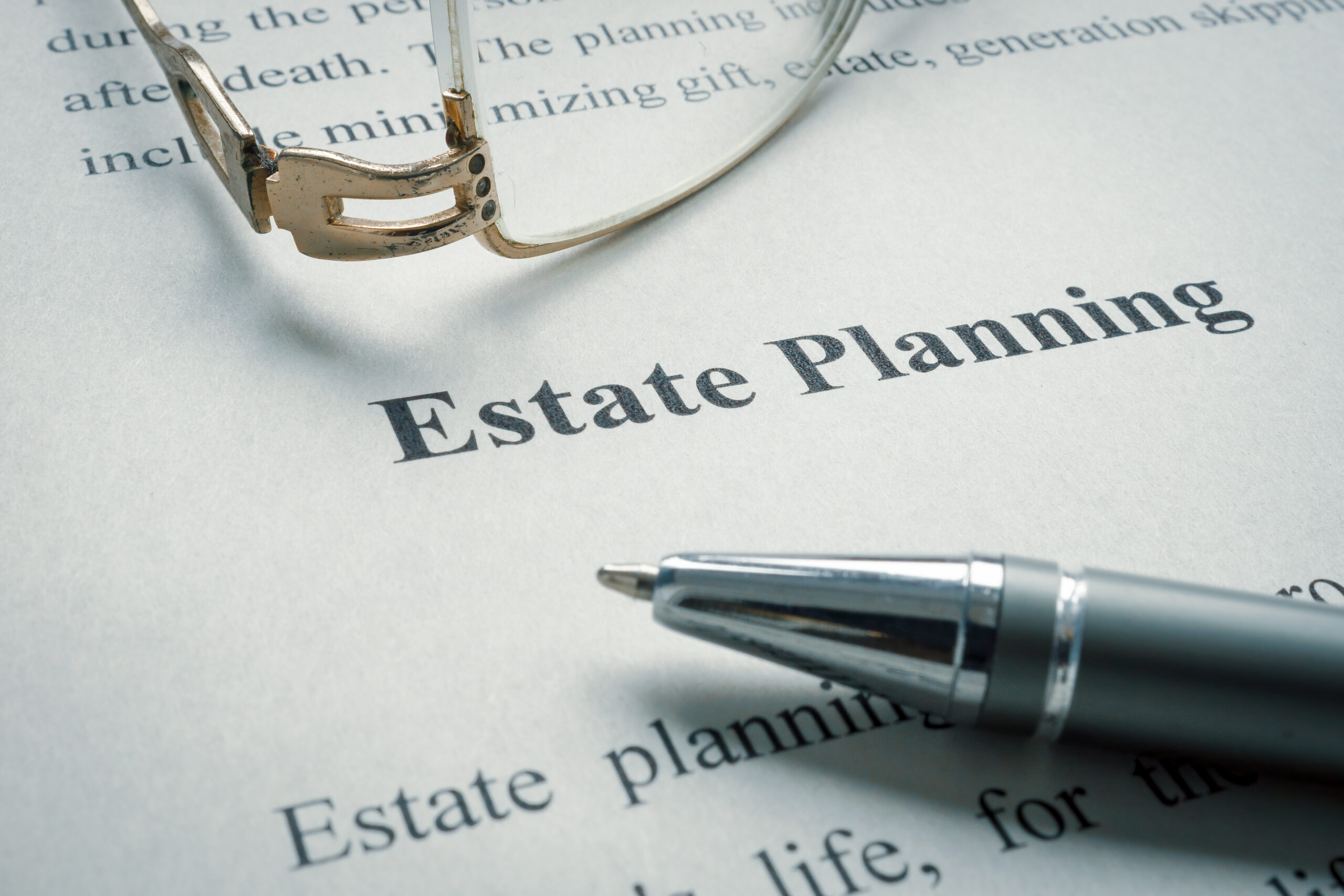 Information about estate planning and old glasses and pen