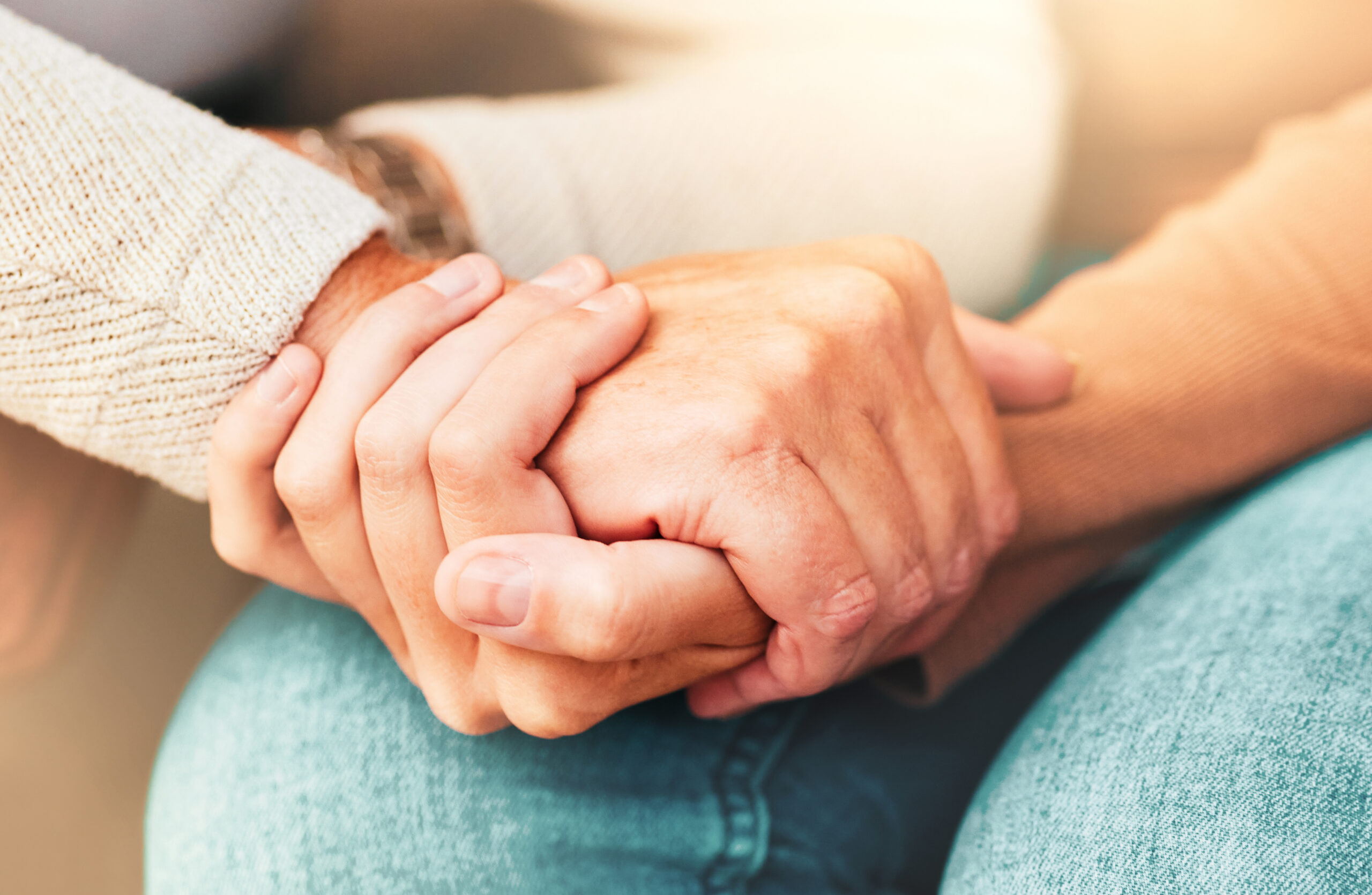 Holding hands in someone's lap