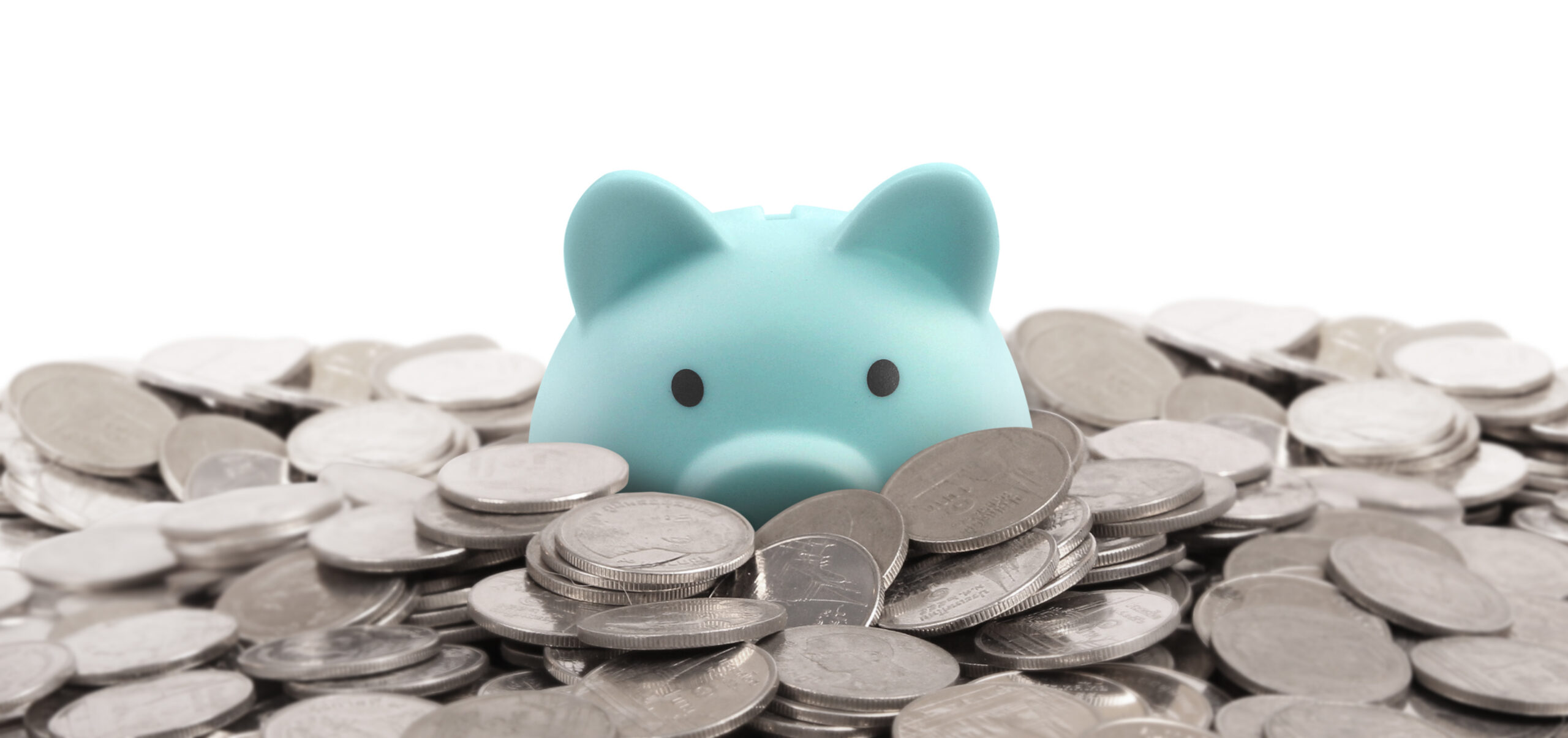 Piggy bank surrounded by silver coins