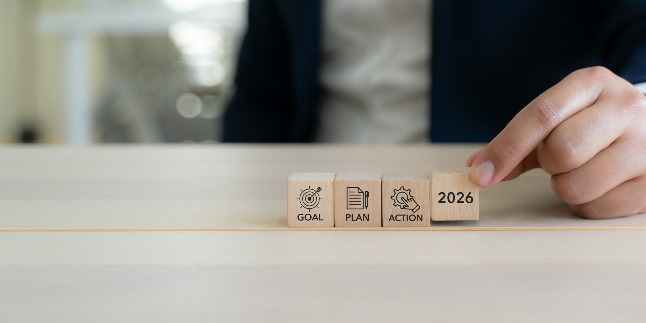 Wooden blocks labeled "2026," "Goal," "Plan," and "Action"