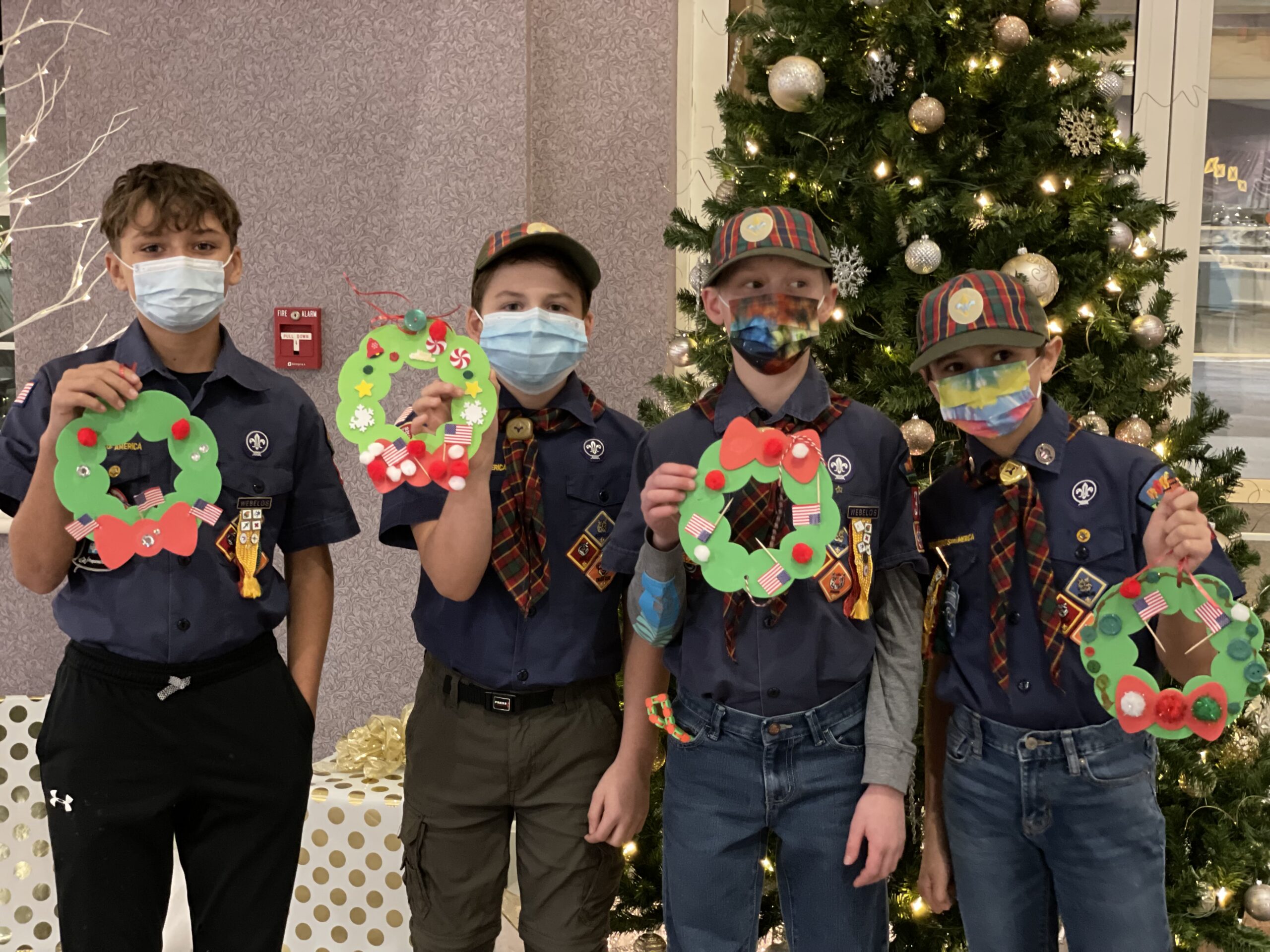 Cub Scouts bring wreath crafts for residents