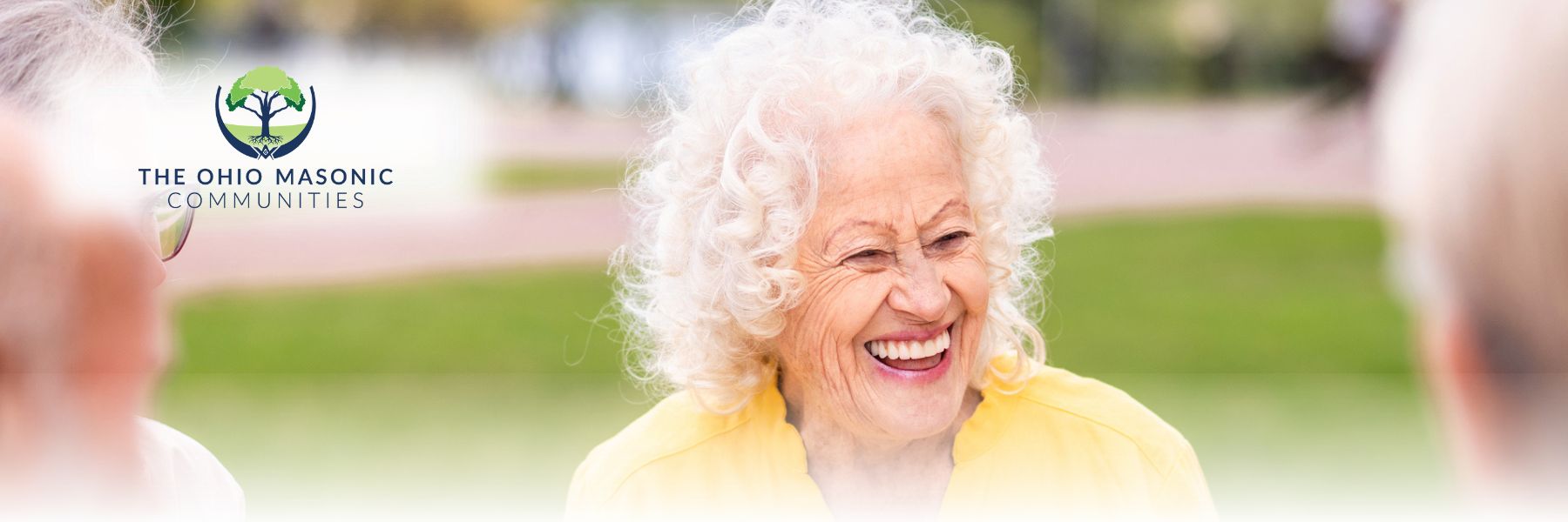 Older adult female smiles outside