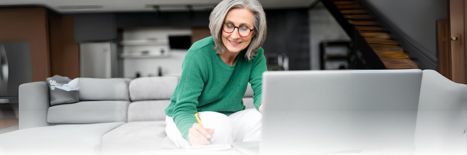 Older adult woman reviewing budget