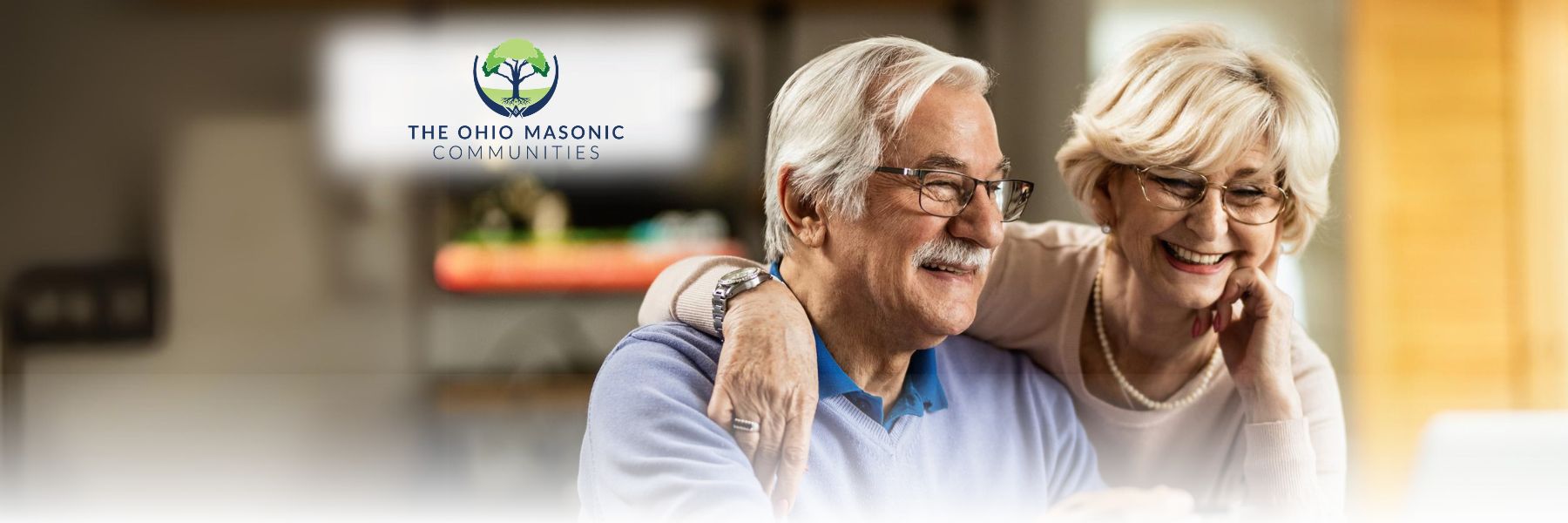 Older adult couple embrace and smile together