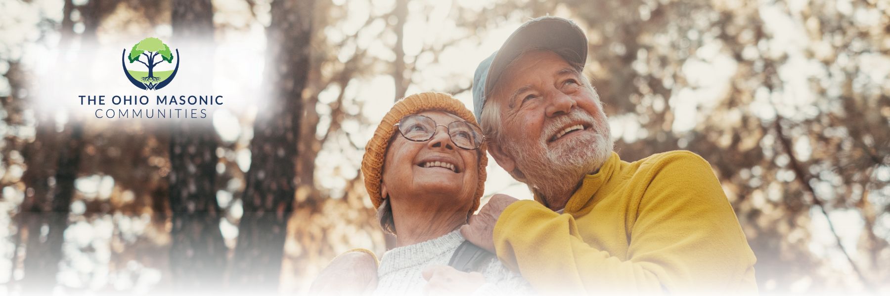 Older adult couple looks upward together outdoors