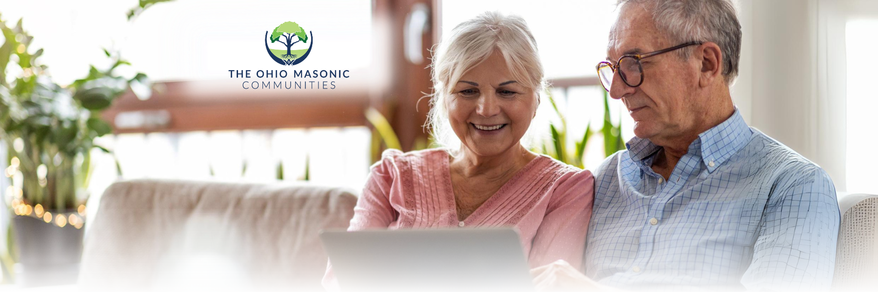 Older adult couple looking at a tablet together