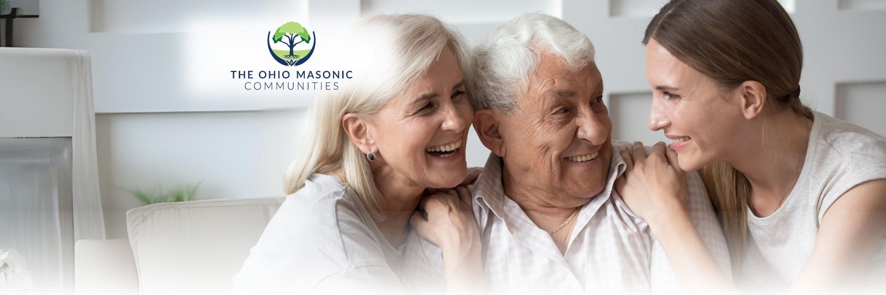 Older adult couple sits by adult female