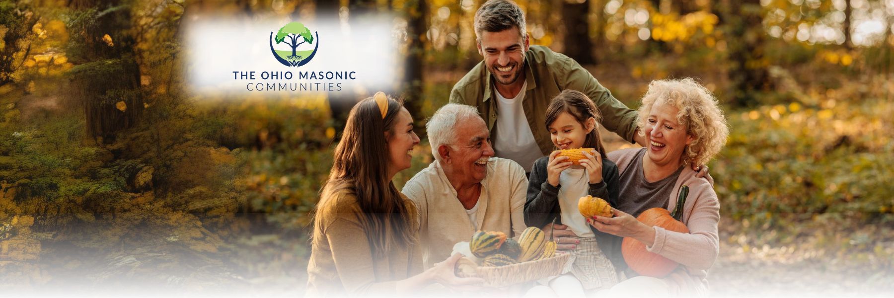 Multi-generational family gathers pumpkins and gourds together in the woods