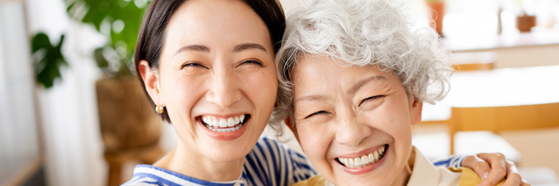 Older adult women and loved one smiling and happy
