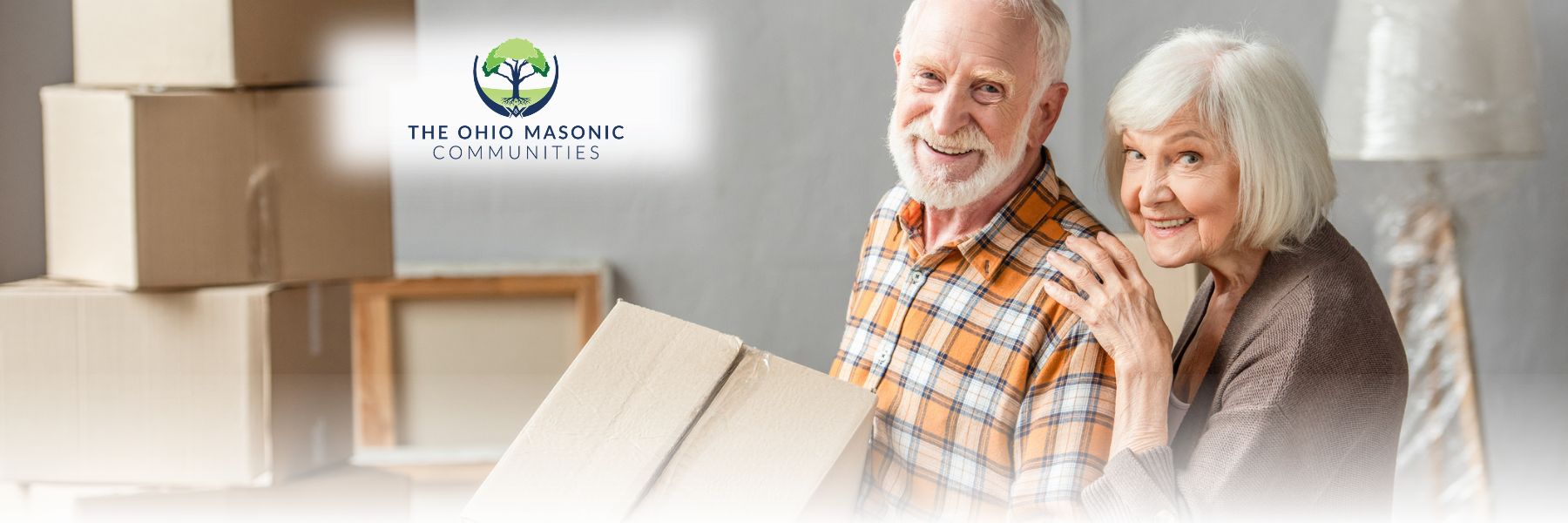 Older adult couple packs boxes