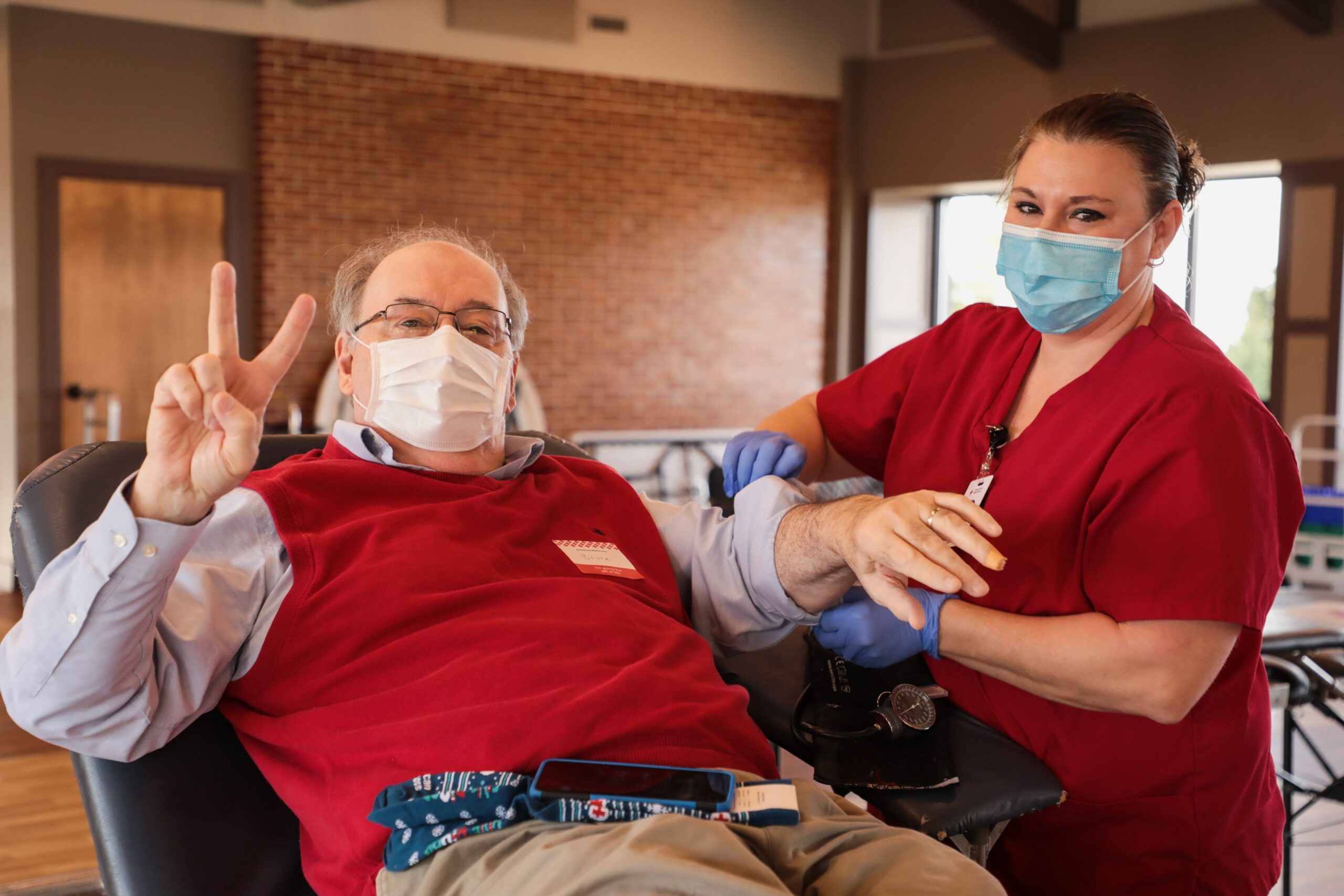Resident donating blood at blood drive