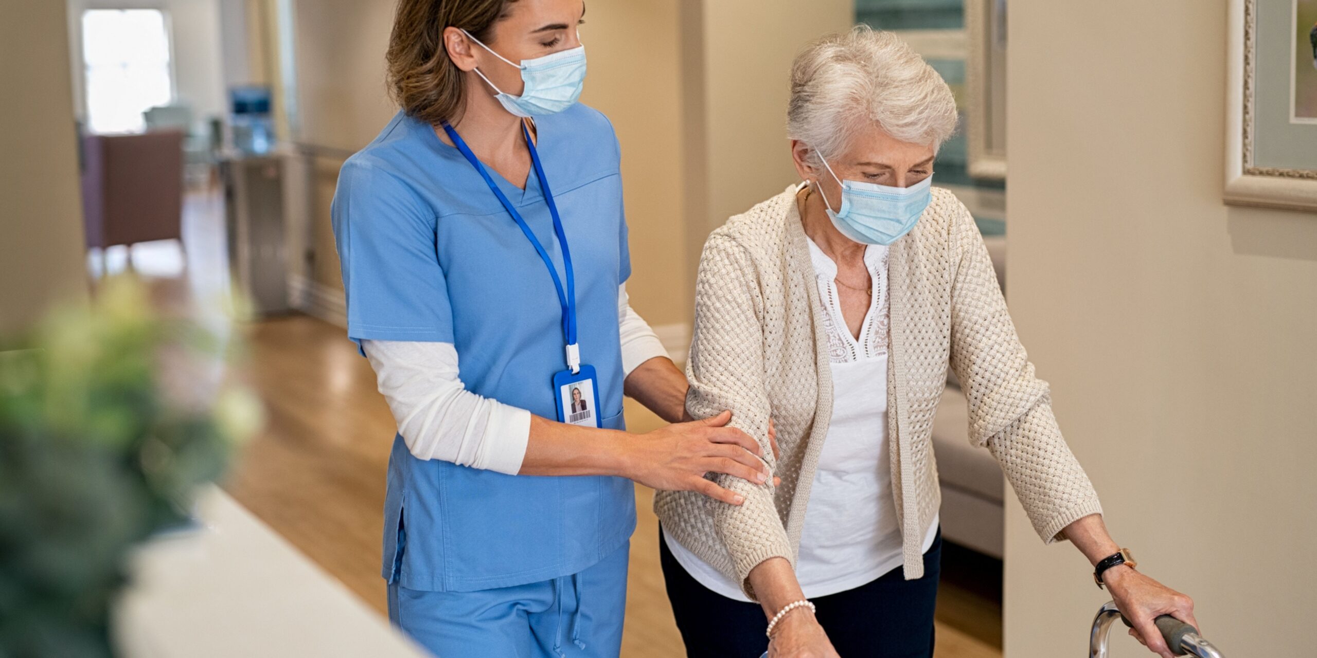 Therapist walks with resident using a walker