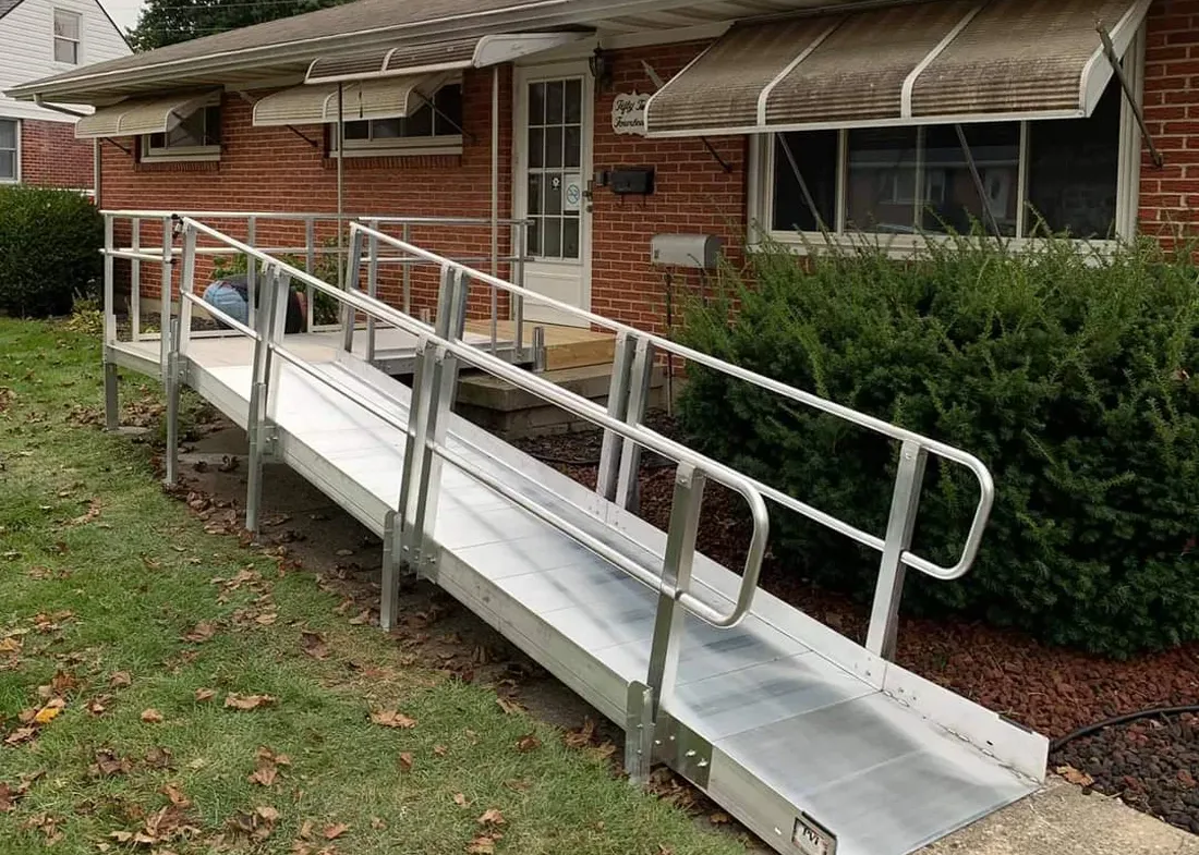 Exterior view of a house with a wheelchair ramp leading to the front door